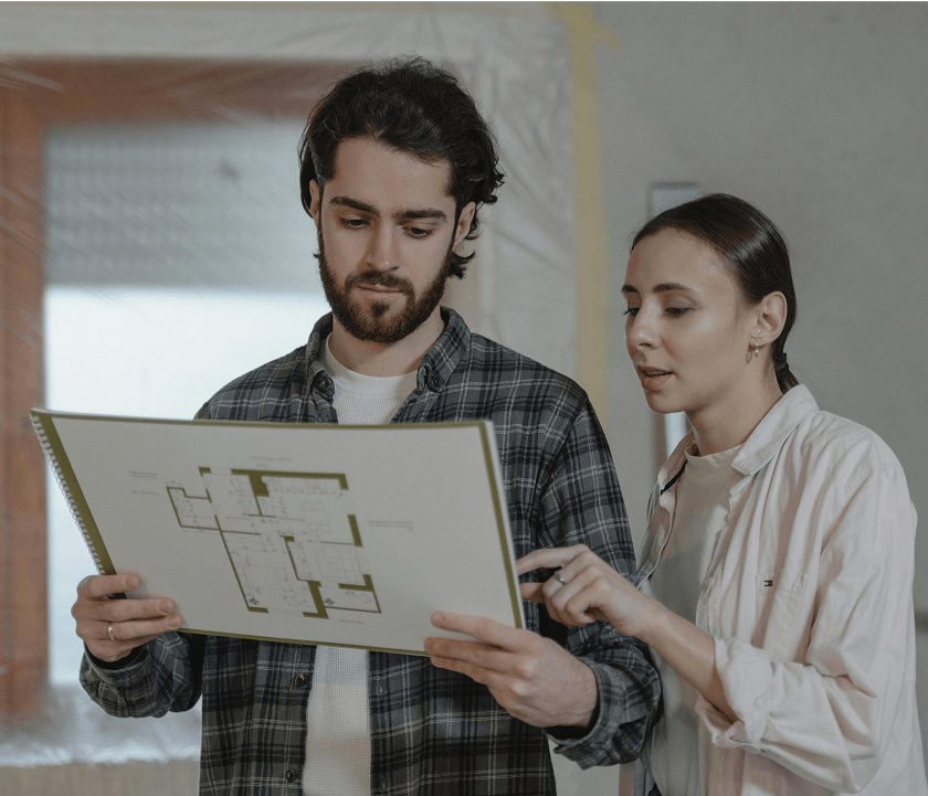 Home owners looking at their home document