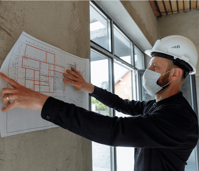 Specialty contractors checking a building plan